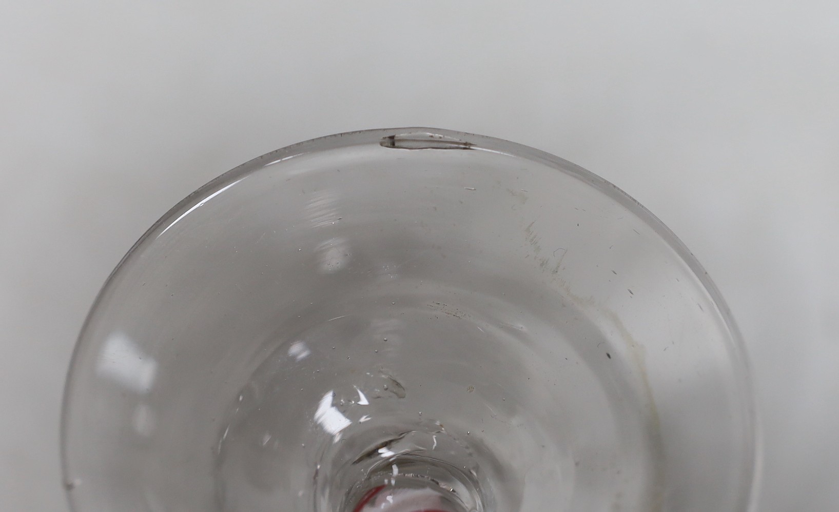 A Dutch red and white colour twist stem wine glass. 15cm tall